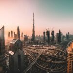 Off-plan property purchase agreement in Dubai skyline showing developments under construction